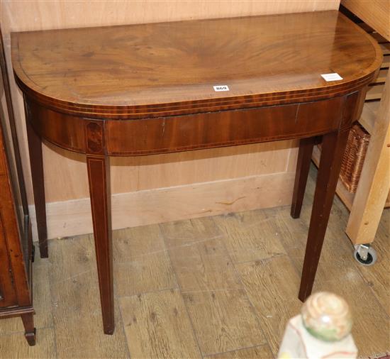 A George III inlaid mahogany D-shape folding card table W.90cm